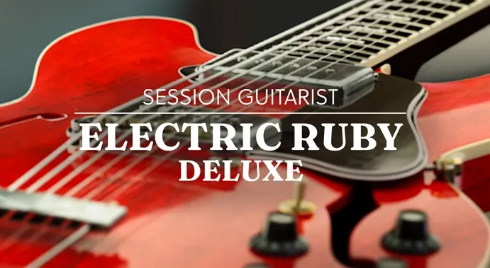 A cherry red hollowbody electric guitar seen from above, its f-hole, bridge and pickups in frame.