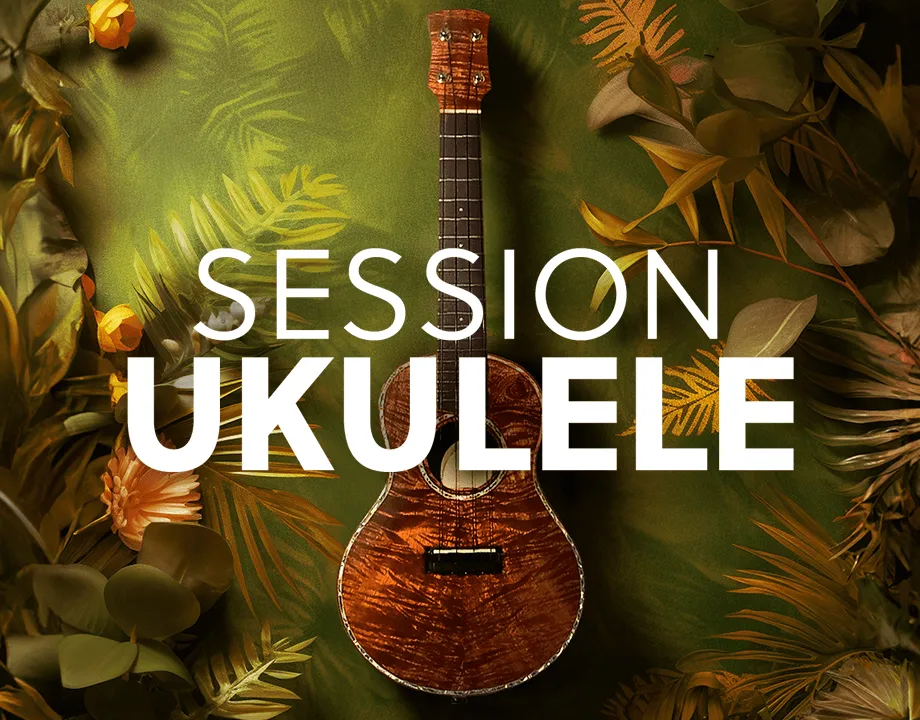 A koa ukulele photographed close up, its figured grain and soundhole in frame.